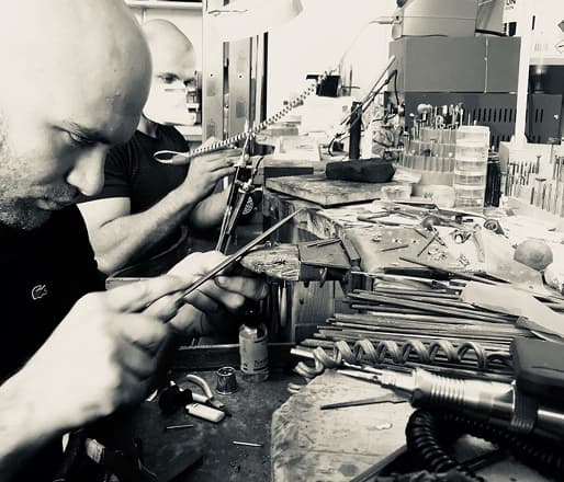 A jeweller assessing a diamond's cut and brilliance in the Scagnetti Cottesloe workshop