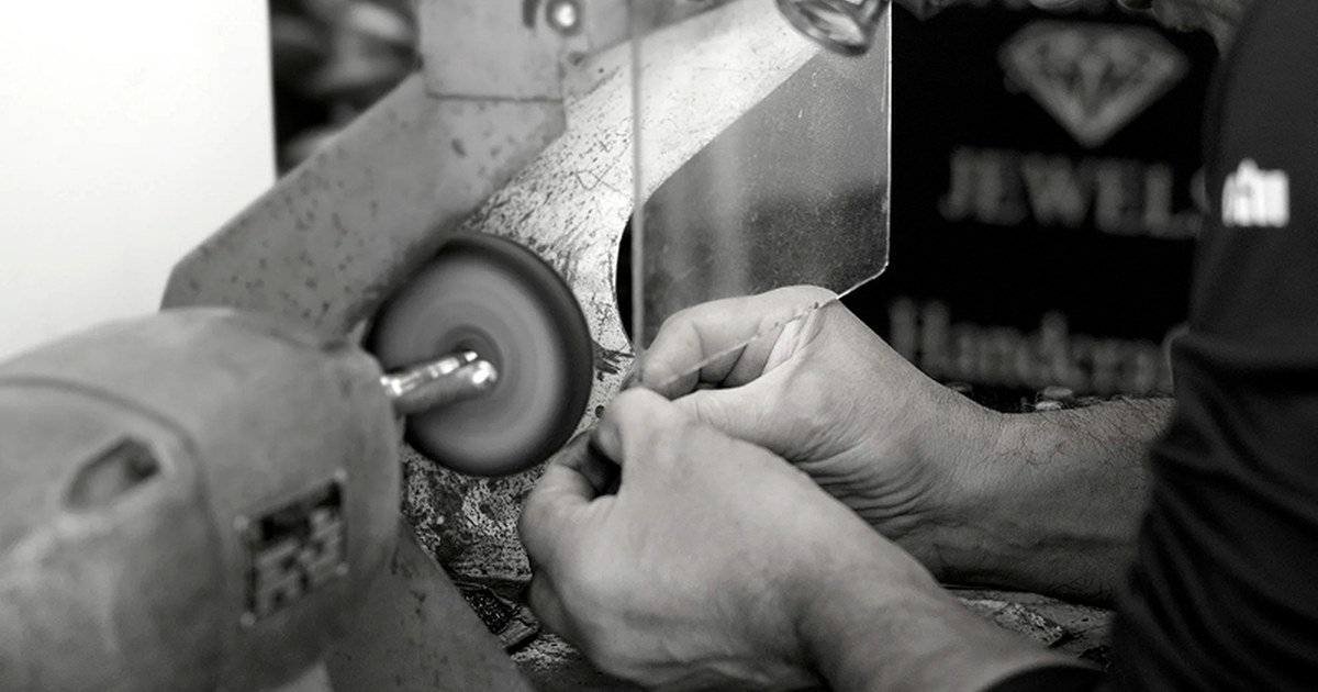 Jeweller polishing a bespoke piece at the bench in Scagnetti’s Perth workshop