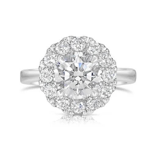 A round brilliant diamond halo engagement ring from the Scagnetti collection, ready to be paired with a wedding band
