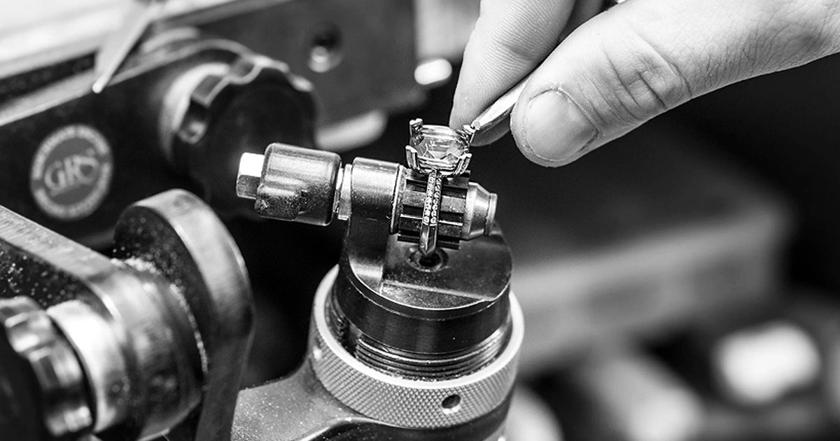 Jeweller setting a diamond engagement ring under magnification in the Scagnetti Cottesloe workshop